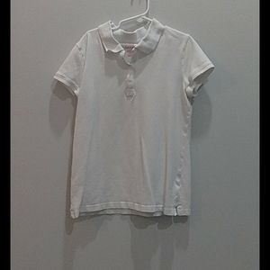 It is a white shirt for girls or boys